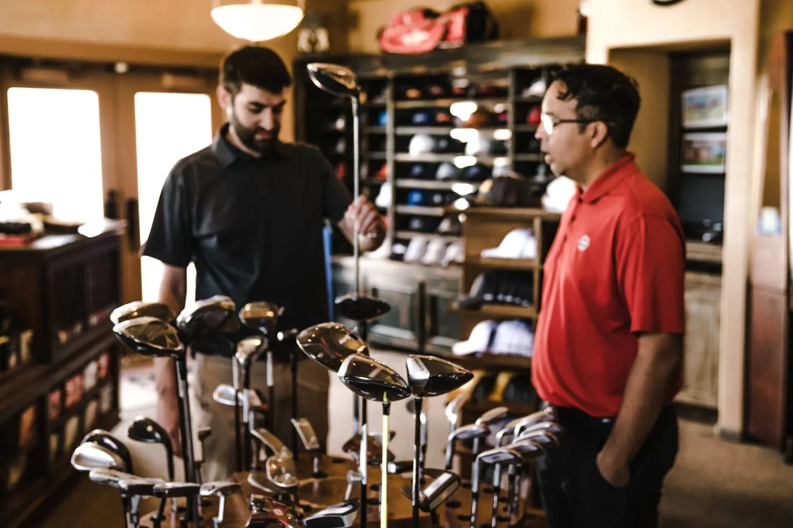 Customer choosing golf clubs sizes